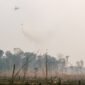 Helicopter of water bombing, was helping them to watered peat soils. Often, watered the flame.